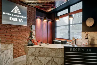 a restaurant with a counter in a brick wall at Hotel Delta in Kraków