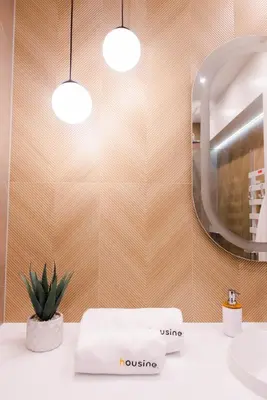 a bathroom with a sink and a mirror and a towel at Forest 47 by Housine in Zator