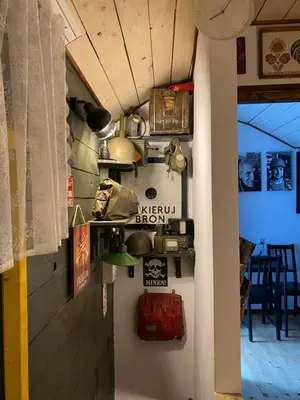 a room with a wall with pots and pans at Zielone Okiennice in Bachowice
