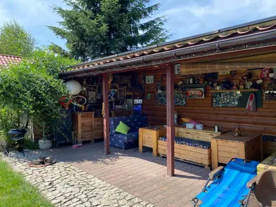 a building with a store with furniture in it at Zielone Okiennice in Bachowice