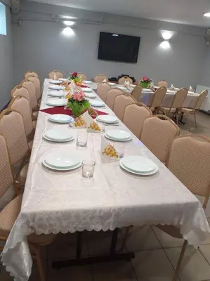 a long table with plates of food on it at Apartamenty Suzyw Pilsko in Pewelka