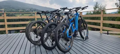 two bikes are parked on a wooden deck at Level780 in Koszarawa