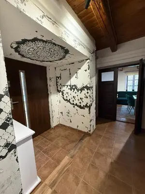 a room with a wall with a painting on it at Domek Bomba Zator Graboszyce in Graboszyce