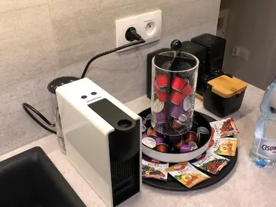 a counter with a blender and a bowl of candy at Wiślane Tarasy 2.0, free parking, private garden in Kraków