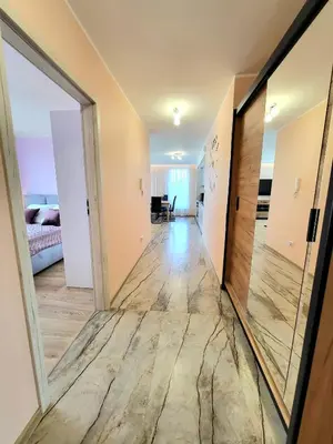 a hallway in a house with a mirror at Eksclusive Apartment PARADISE DOWN TOWN 6 persons 3 rooms in Kraków