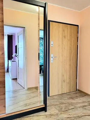 a mirror in a room with a door at Eksclusive Apartment PARADISE DOWN TOWN 6 persons 3 rooms in Kraków