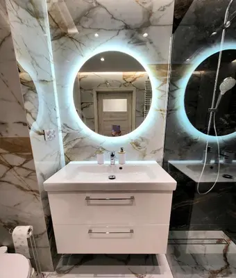 a bathroom with a white sink and a mirror at Eksclusive Apartment PARADISE DOWN TOWN 6 persons 3 rooms in Kraków