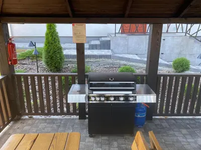 a barbecue grill sitting on a outdoor patio at Apartamenty Zander in Zator