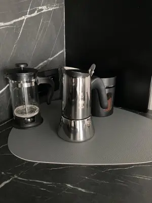 two appliances sitting on top of a counter at Kraków Green Hill Luxury Apartment in Balice
