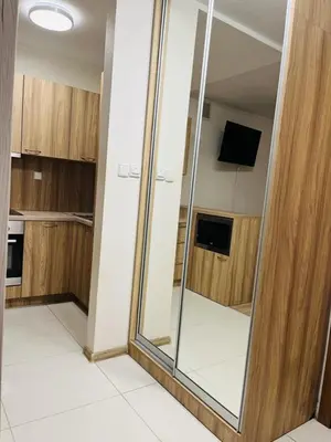an empty kitchen with a mirror in a room at H6 MAJOR ApartHotel Travel & Business, FREE PARKING in Kraków