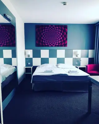 a room with a bed and a desk and a room with at H6 MAJOR ApartHotel Travel & Business, FREE PARKING in Kraków