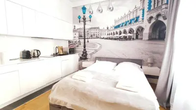 a bedroom with a white bed and a street at Skawińska 10 by Homeprime in Kraków