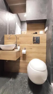 a bathroom with a white toilet and a sink at Skawińska 10 by Homeprime in Kraków