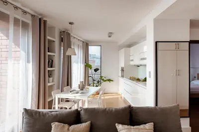 a living room with a couch and a table at Spacious apartment close to Main Station / Galeria Krakowska in Kraków