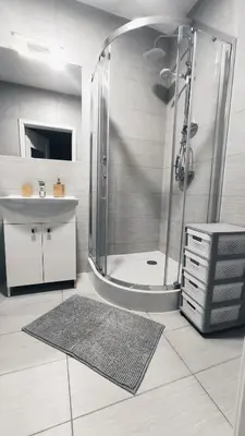 a bathroom with a shower and a sink at Dąbska 18D by Homeprime in Kraków