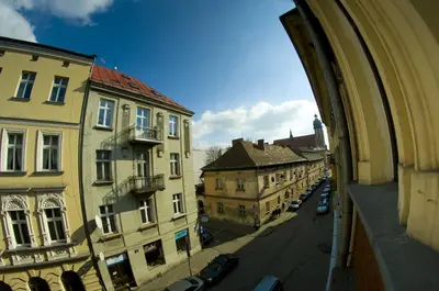 a view of a city street from a building at New Sweet One in Kraków