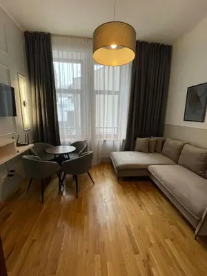 a living room with a couch and a table at ON/SET APARTHOTEL in Kraków
