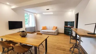 a living room with a table and a couch at Bogusławskiego 5 by Homeprime in Kraków