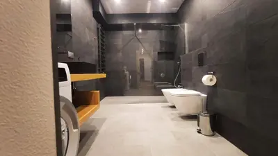 a bathroom with a toilet and a sink at Bogusławskiego 5 by Homeprime in Kraków