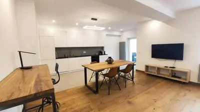 a living room with a table and a tv at Bogusławskiego 5 by Homeprime in Kraków
