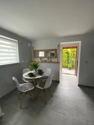 a dining room with a table and chairs at Apartament Lotos in Zator