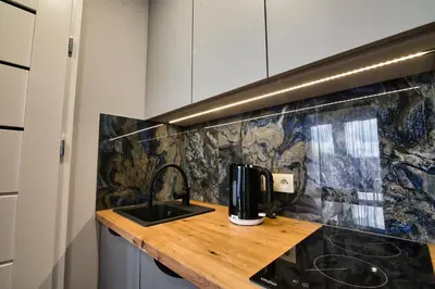 a kitchen counter with a coffee maker on it at Apartament dla dwojga in Zator