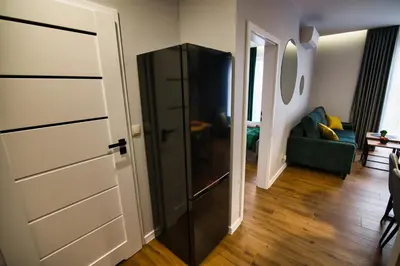 a black cabinet in a room with a living room at Capital apartaments in Zator