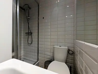 a bathroom with a toilet and a shower and a sink at Mazowiecka 11 by Homeprime in Kraków
