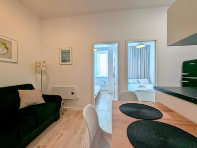 a living room with a couch and a table at Mazowiecka 11 by Homeprime in Kraków
