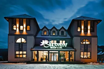 a building with a sign on the front of it at Jasmin Complex Resort & Spa in Krzeszów Dolny
