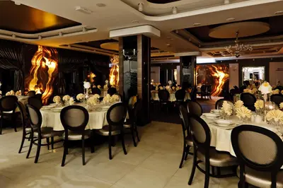 a banquet hall with white tables and chairs at Jasmin Complex Resort & Spa in Krzeszów Dolny