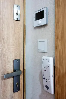 a door with a nintendo wii controller on it at Aparts Near Main Station in Kraków