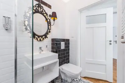 a bathroom with a white sink and a mirror at Traveler's Best Choice - Old Town Guesthouse - by Upstairs in Kraków