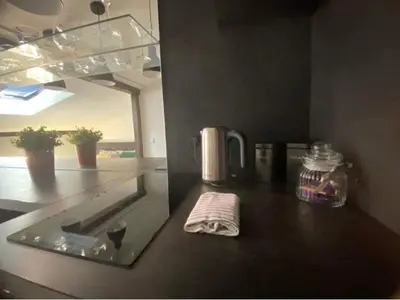 a kitchen counter with a towel on a counter top at Jack Apartment in Old Town in Kraków