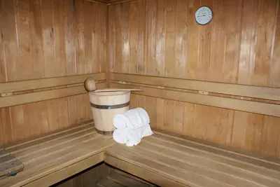 a sauna with a roll of toilet paper and a spoon at Hotel Monttis in Sucha Beskidzka