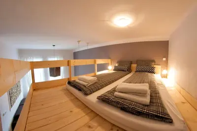 a room with two beds in a room with at Kasia&Lukasz Apartments in Kraków