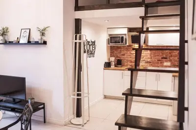 a room with a kitchen and a living room at Kasia&Lukasz Apartments in Kraków