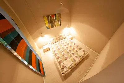 an overhead view of a room with a bed and a painting at Kasia&Lukasz Apartments in Kraków