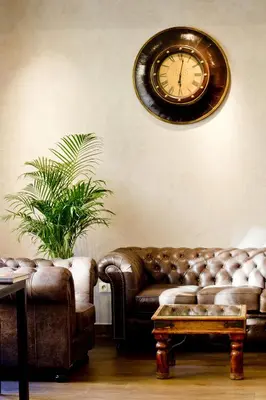 a hotel room with a bed with a plate of food on it at Hotel Columbus in Kraków