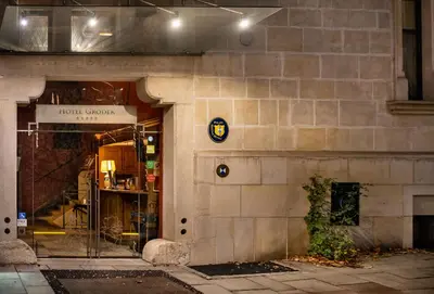 a store front with a sign on the side of a building at Hotel Gródek in Kraków