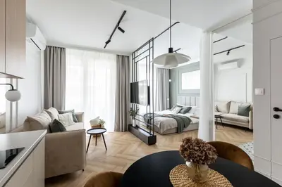 a living room with a couch and a table at #1 OLIVE Apartment City Center FREE GARAGE in Kraków