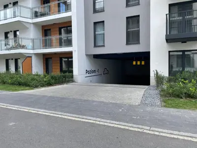 a building with a garage with the word portal on it at #1 OLIVE Apartment City Center FREE GARAGE in Kraków