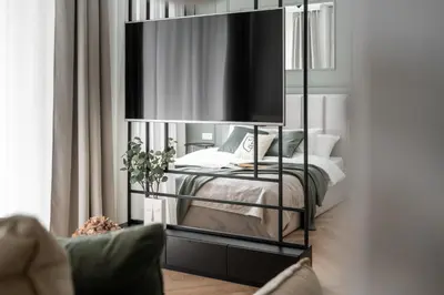 a bedroom with a bed and a large mirror at #1 OLIVE Apartment City Center FREE GARAGE in Kraków