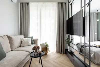 a living room with a couch and a tv at #1 OLIVE Apartment City Center FREE GARAGE in Kraków