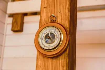 a wooden clock attached to a wooden pole at RESETówka nr 3 - domek na odludziu z mega widokami - Lazurowe Love in Jaszczurowa