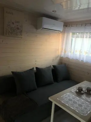 a living room with a couch and a table at Słoneczne ranczo Zator Energylandia in Zator
