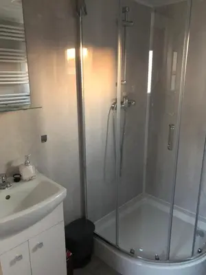 a bathroom with a shower and a sink at Słoneczne ranczo Zator Energylandia in Zator