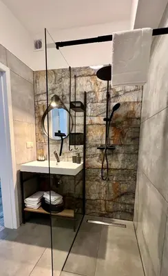 a bathroom with a shower and a sink at Flow 8 by Housine in Zator