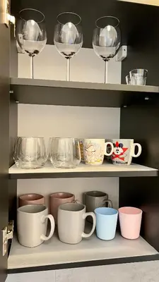 a shelf filled with cups and wine glasses at Chill & Fun 22 by Housine in Zator