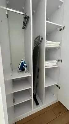 a closet with white shelves and a baseball bat at Chill & Fun 22 by Housine in Zator